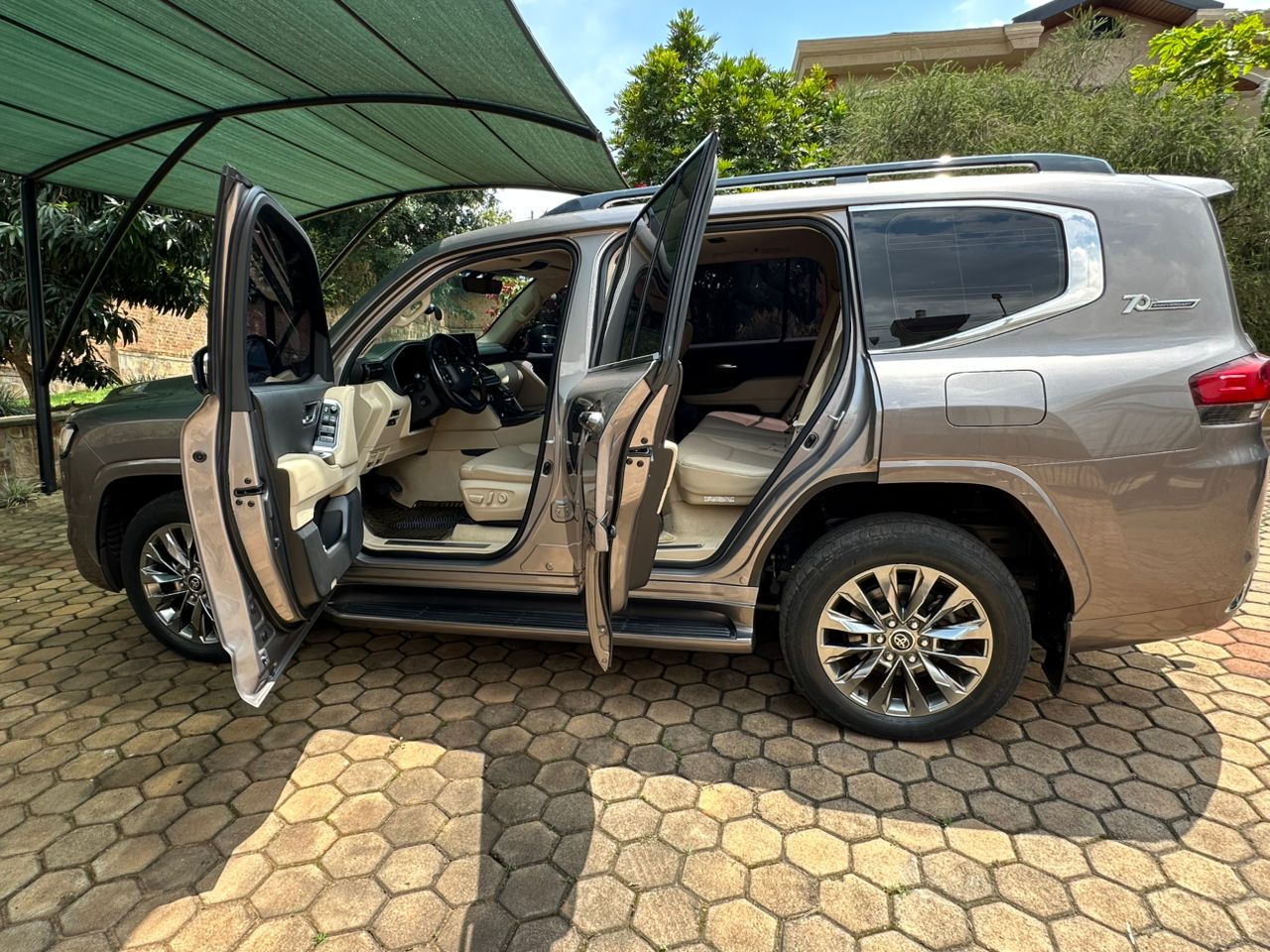 A white 4x4 Toyota RAV4 SUV available for Toyota RAV4 Rental Kigali parked near Kigali International Airport.