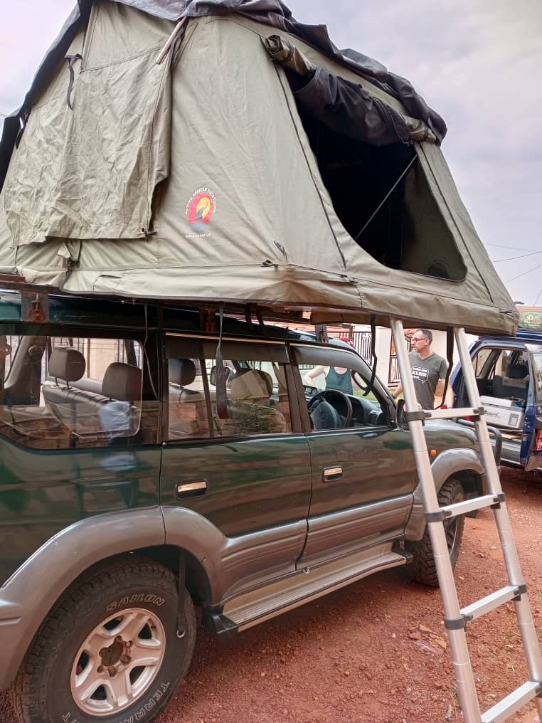 Toyota Land Cruiser Prado with double rooftop tent setup for Rwanda camping safari.
